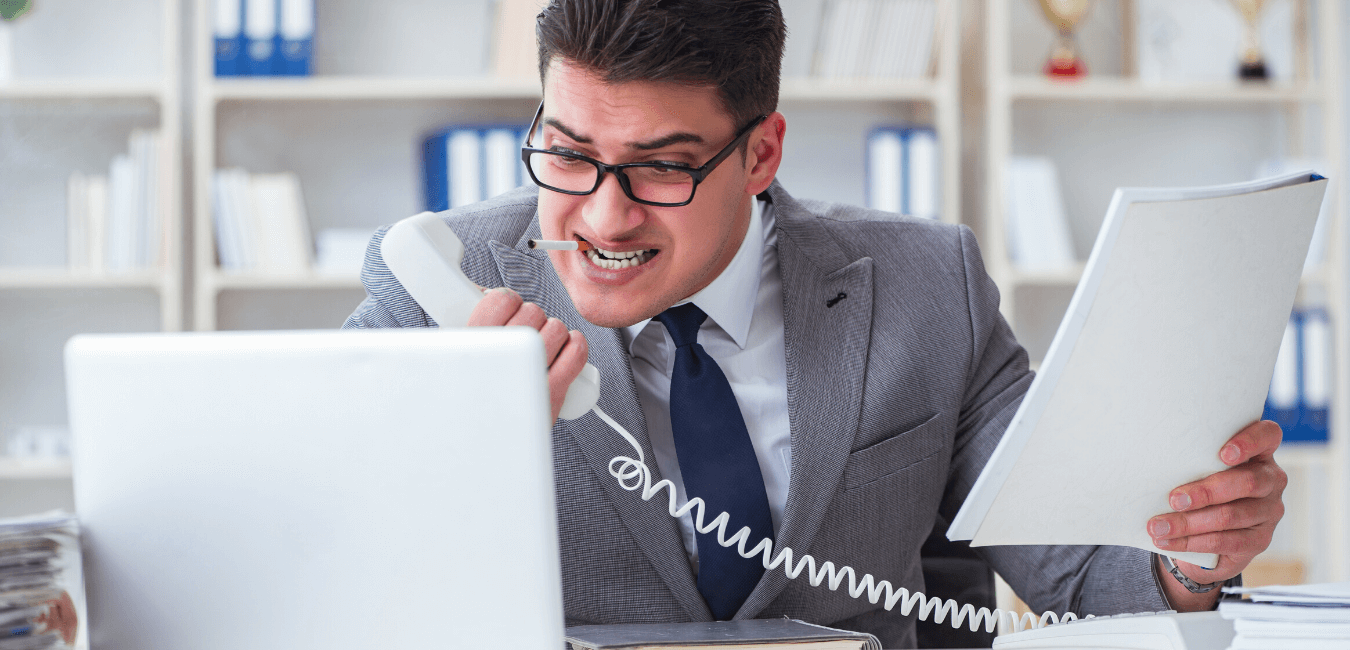 angry man on phone dealing with employee turnover